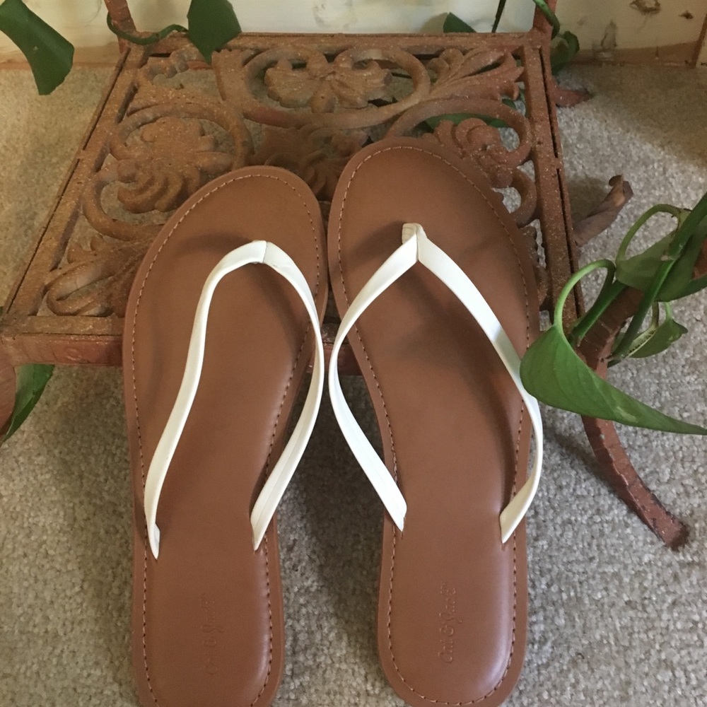 White and tan flip-flops